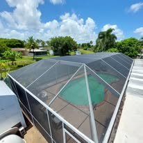 Pool cage with solar panel roof integration